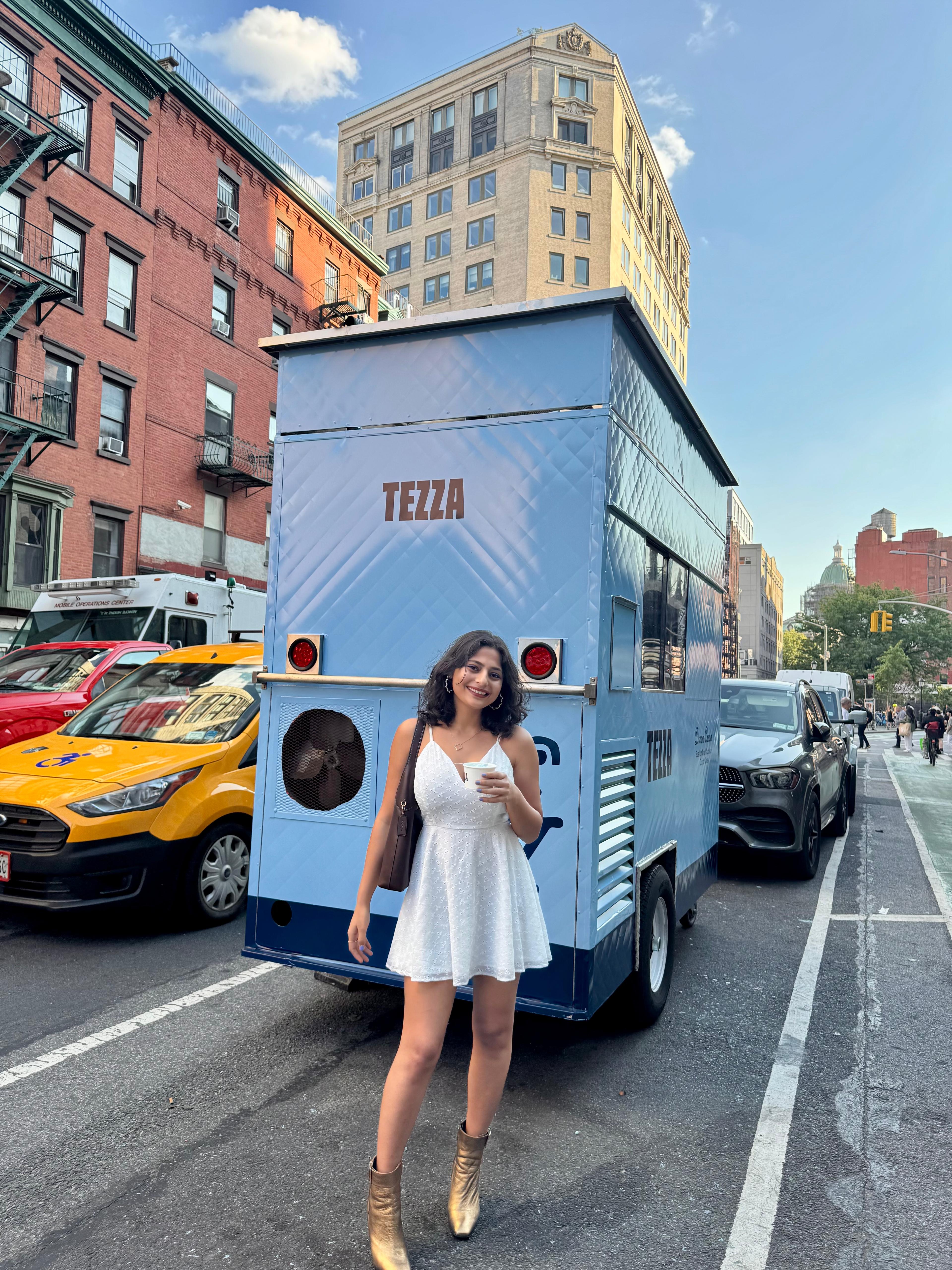Khushboo on a city street in a white dress